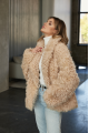 Women's two-sided sheepskin jacket made of natural sheepskin in beige color