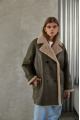 Women's sheepskin coat of gray color made of natural sheepskin in VINTAGE style