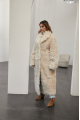 A long two-sided sheepskin coat made of milk-colored natural sheepskin