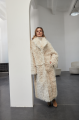 A long two-sided sheepskin coat made of milk-colored natural sheepskin