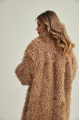 Long two-sided sheepskin coat made of natural sheepskin in camel color