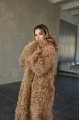 Long two-sided sheepskin coat made of natural sheepskin in camel color