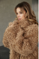 Long two-sided sheepskin coat made of natural sheepskin in camel color