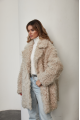 A stylish double-sided sheepskin jacket made of natural white sheepskin