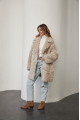 A stylish double-sided sheepskin jacket made of natural white sheepskin