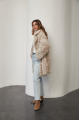 A stylish double-sided sheepskin jacket made of natural white sheepskin