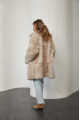 A stylish double-sided sheepskin jacket made of natural white sheepskin