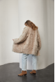 A stylish double-sided sheepskin jacket made of natural white sheepskin