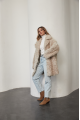 A stylish double-sided sheepskin jacket made of natural white sheepskin