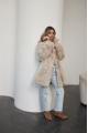 A stylish double-sided sheepskin jacket made of natural white sheepskin