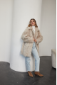 A stylish double-sided sheepskin jacket made of natural white sheepskin