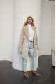 A stylish double-sided sheepskin jacket made of natural white sheepskin