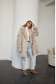 A stylish double-sided sheepskin jacket made of natural white sheepskin