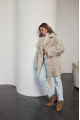 A stylish double-sided sheepskin jacket made of natural white sheepskin