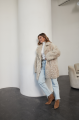 A stylish double-sided sheepskin jacket made of natural white sheepskin