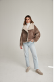 Women's short sheepskin-jacket of brown color made of natural sheepskin in VINTAGE style