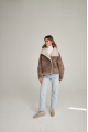 Women's short sheepskin-jacket of brown color made of natural sheepskin in VINTAGE style