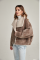 Women's short sheepskin-jacket of brown color made of natural sheepskin in VINTAGE style