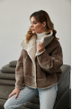 Women's short sheepskin-jacket of brown color made of natural sheepskin in VINTAGE style