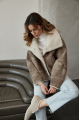 Women's short sheepskin-jacket of brown color made of natural sheepskin in VINTAGE style