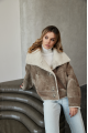 Women's short sheepskin-jacket of brown color made of natural sheepskin in VINTAGE style