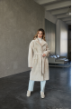 Long two-sided sheepskin coat made of natural sheepskin in beige color