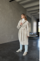 Long two-sided sheepskin coat made of natural sheepskin in beige color