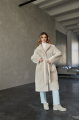 Long two-sided sheepskin coat made of natural sheepskin in beige color