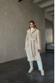 Long two-sided sheepskin coat made of natural sheepskin in beige color