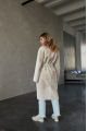 Long two-sided sheepskin coat made of natural sheepskin in beige color