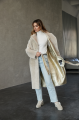 Long two-sided sheepskin coat made of natural sheepskin in beige color