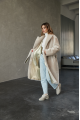 Long two-sided sheepskin coat made of natural sheepskin in beige color