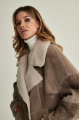 Women's sheepskin-jacket of brown color made of natural sheepskin in VINTAGE style