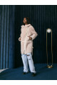 Women's sheepskin coat made of cream-colored natural sheepskin wool