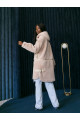 Women's sheepskin coat made of cream-colored natural sheepskin wool