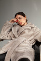 Women's coat of gray color made of ECO fur