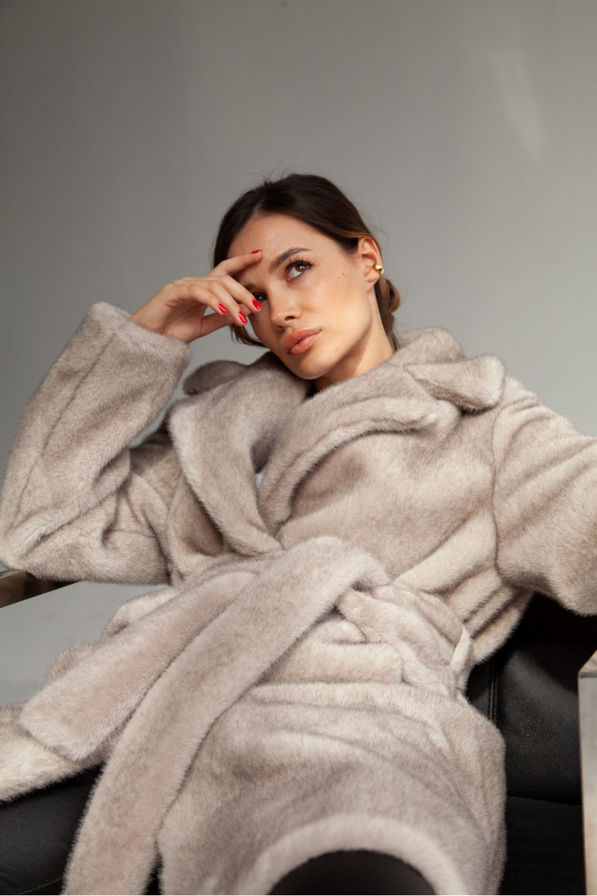Women's coat of gray color made of ECO fur