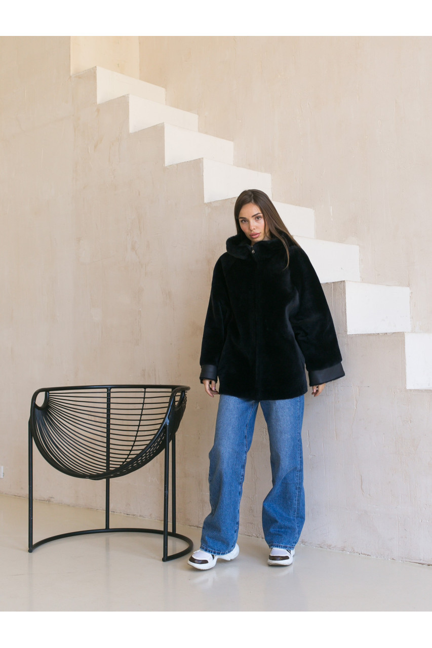 Two-sided sheepskin coat of dark blue color with a hood
