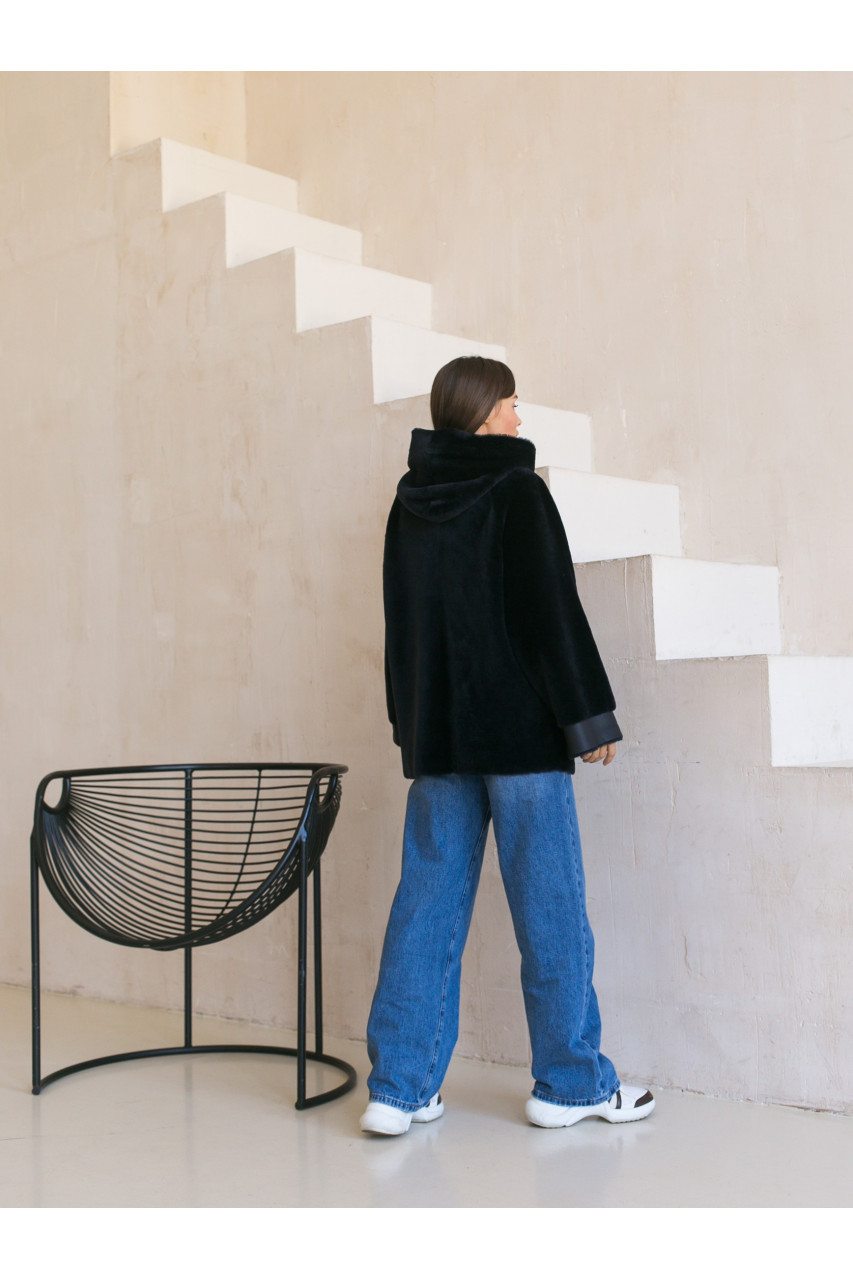 Two-sided sheepskin coat of dark blue color with a hood