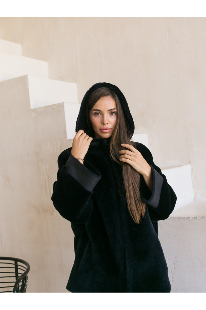 Two-sided sheepskin coat of dark blue color with a hood