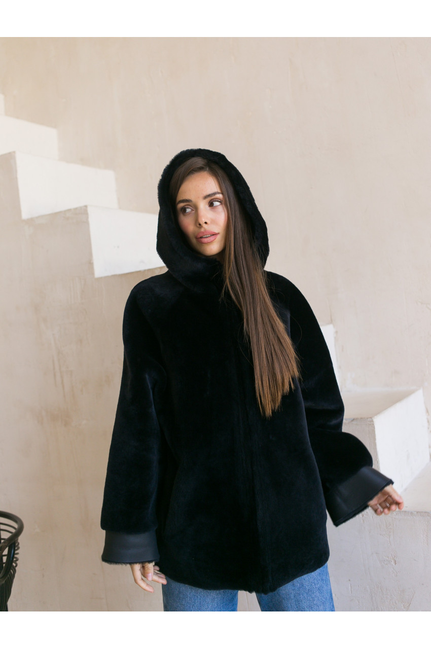 Two-sided sheepskin coat of dark blue color with a hood