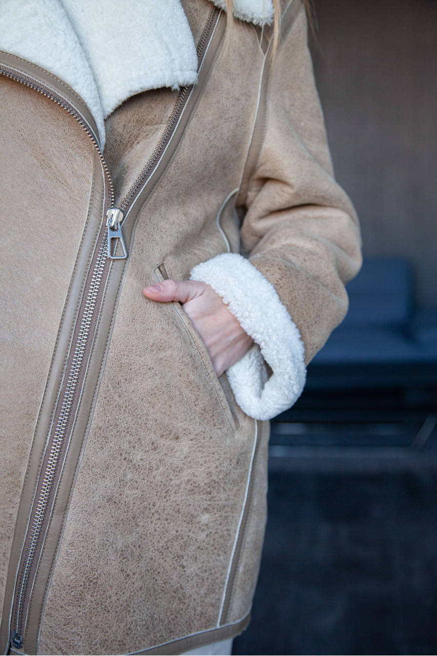 Women's beige sheepskin coat in VINTAGE style made of natural sheepskin