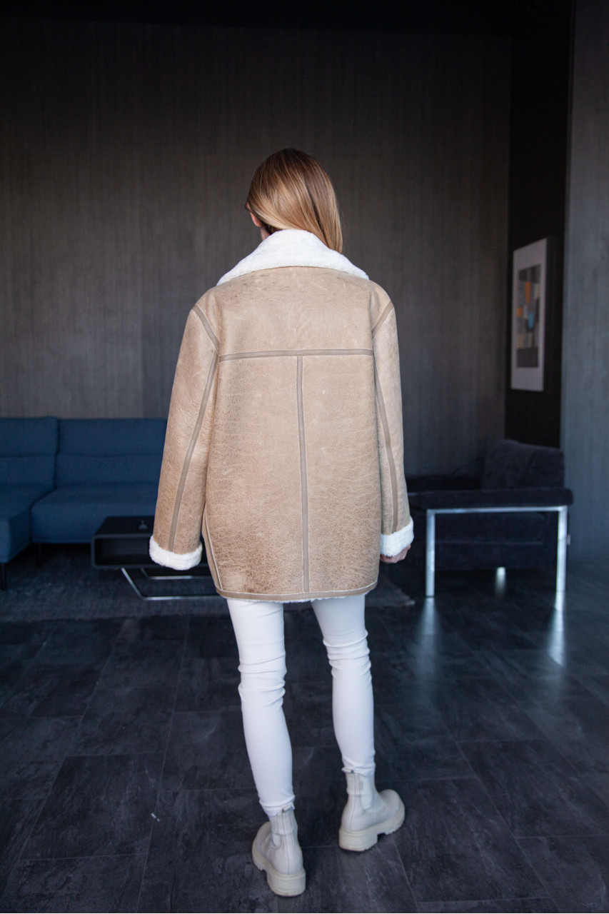 Women's beige sheepskin coat in VINTAGE style made of natural sheepskin