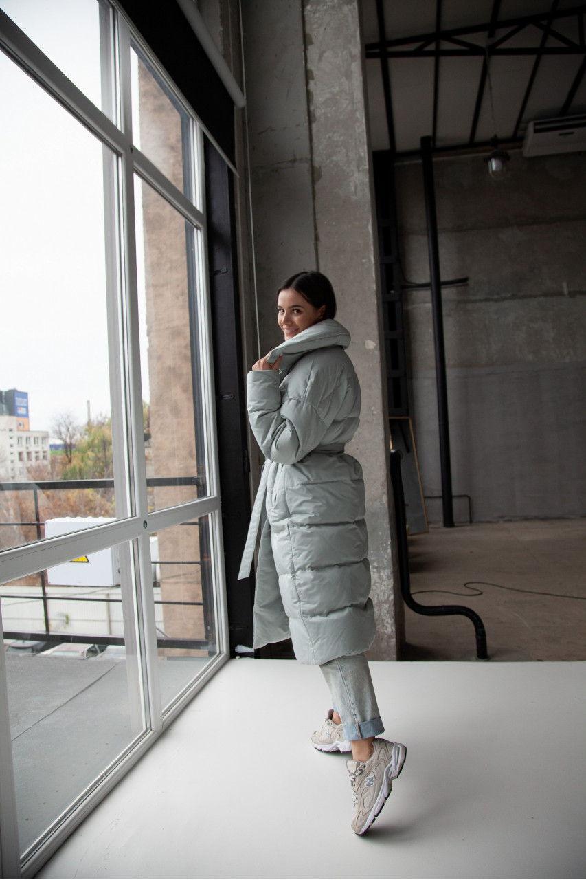 Women's long down jacket in mint color with natural filler