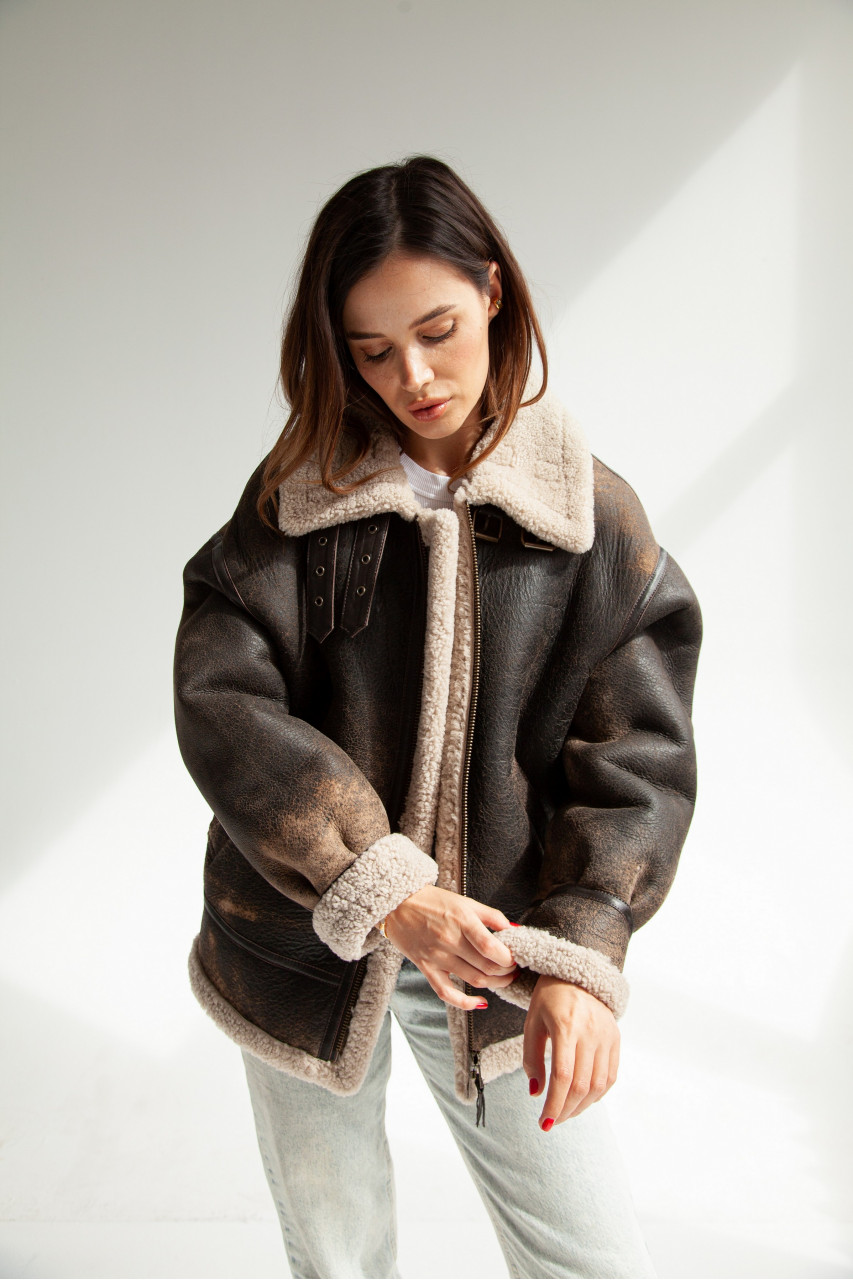 Stylish women's sheepskin coat made of natural sheepskin in VINTAGE style