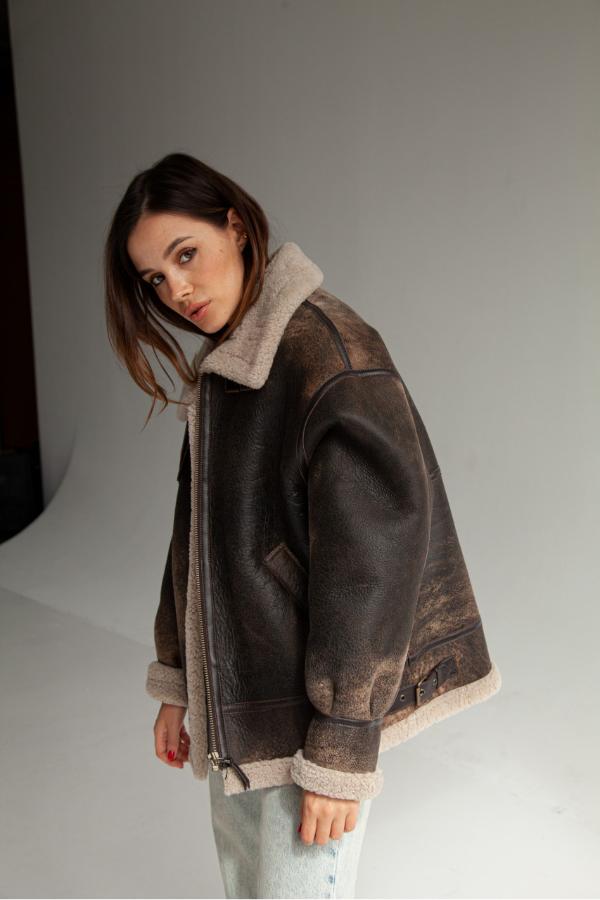 Stylish women's sheepskin coat made of natural sheepskin in VINTAGE style