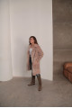Women's sheepskin coat made of natural wool in a light caramel color