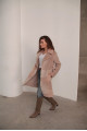 Women's sheepskin coat made of natural wool in a light caramel color