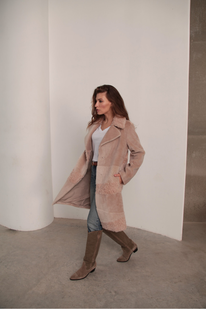 Women's sheepskin coat made of natural wool in a light caramel color
