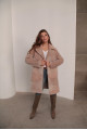 Women's sheepskin coat made of natural wool in a light caramel color